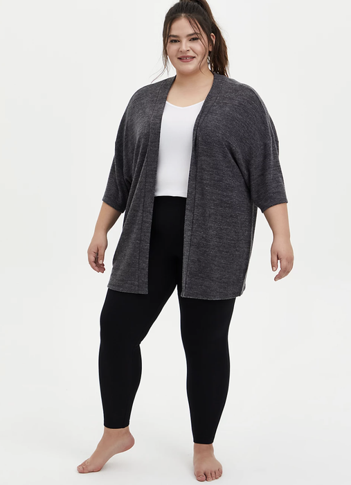 Model styled in black fleece-lined leggings