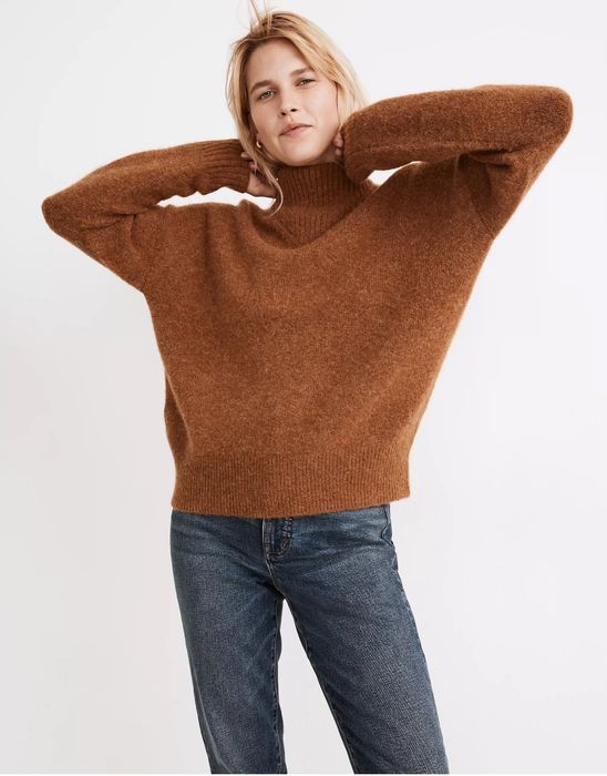 Model showcasing the brown pullover.