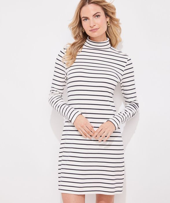 Model wearing a striped turtleneck dress from Vineyard Vines