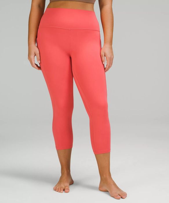 model wearing coral leggings