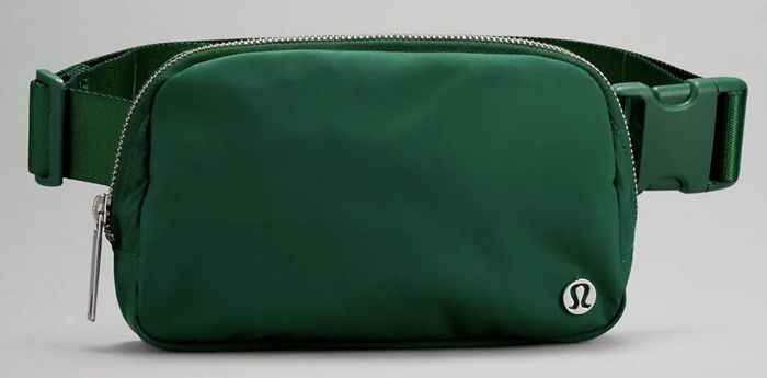 A product shot featuring the belt bag in green.