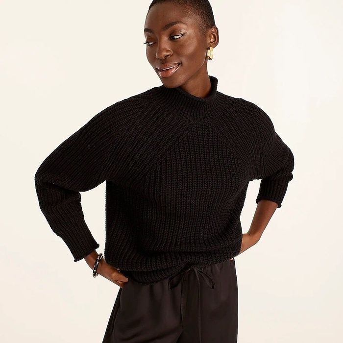 Model showcasing the black sweater