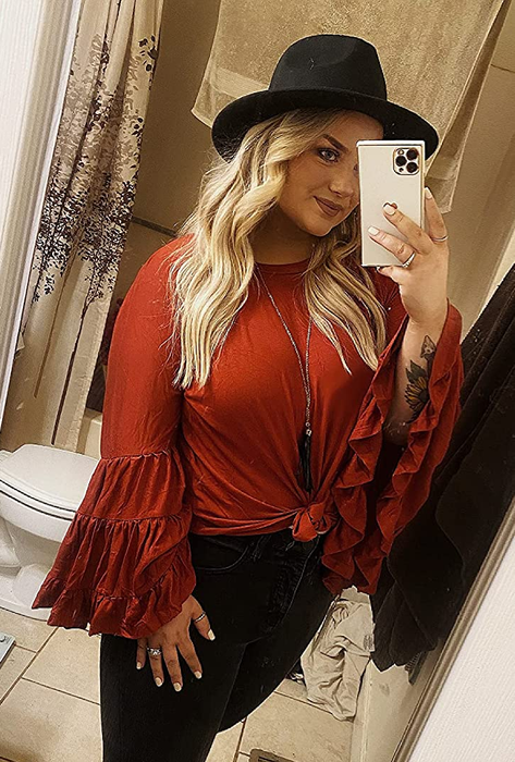 a reviewer wearing the burnt orange version