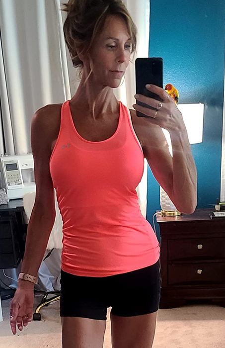 Image of a reviewer wearing a pink tank