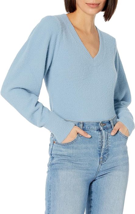 Model showcasing the light blue V-neck