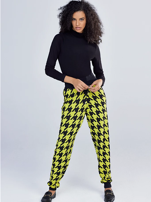 Model showcasing yellow houndstooth joggers