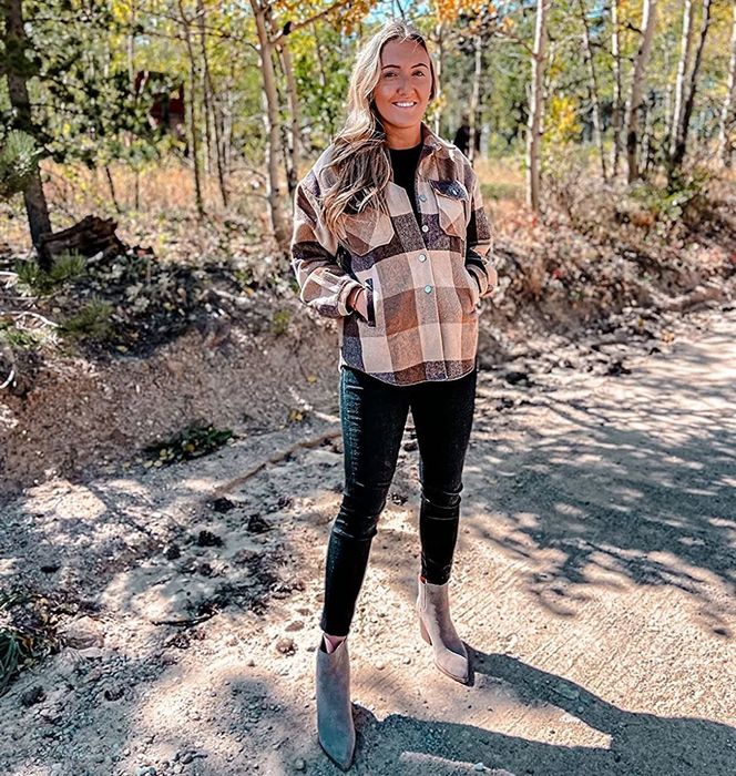 A reviewer dons a tan and brown plaid shacket.