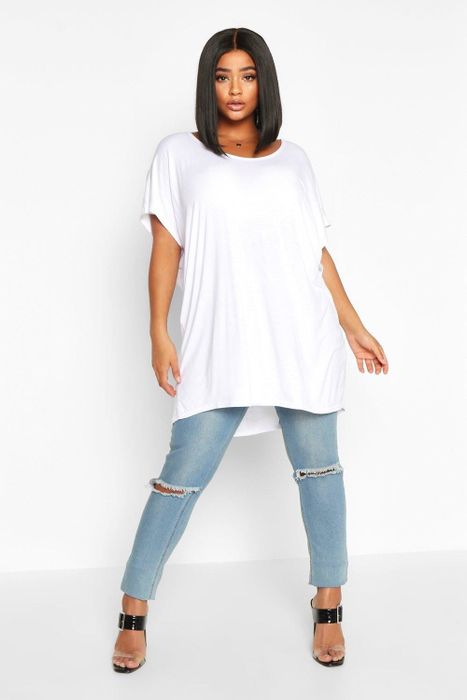 Model photographed in a white oversized T-shirt