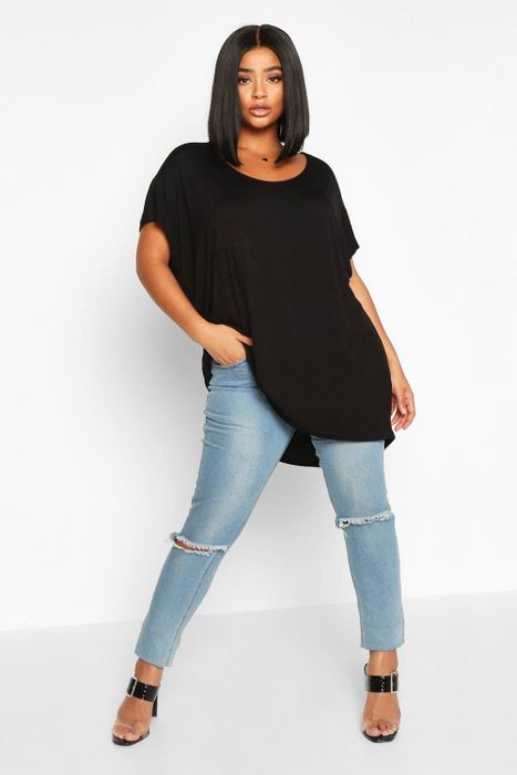 Model styled in a black oversized T-shirt
