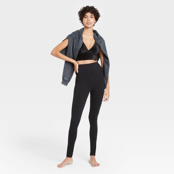 A model in the black leggings