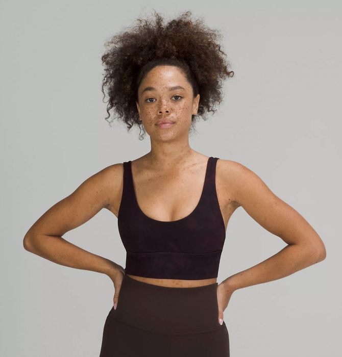 Front view of the model wearing the brown sports bra.