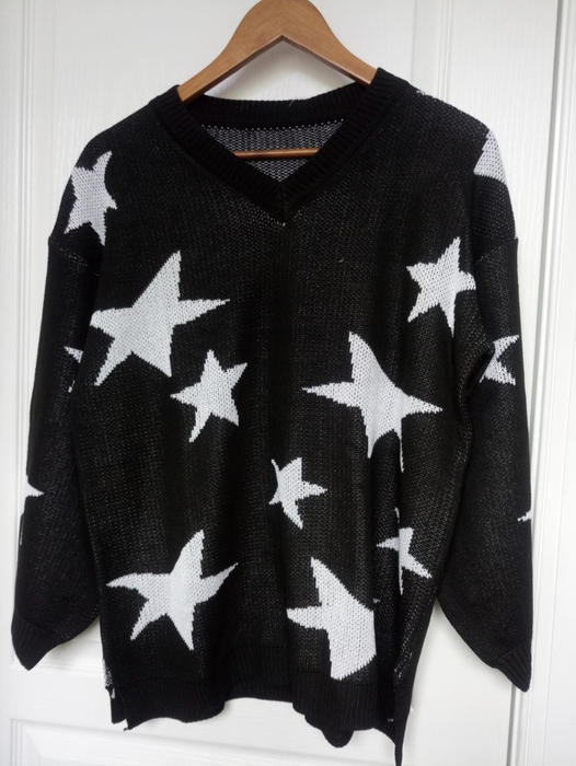 The sweater is available in black.