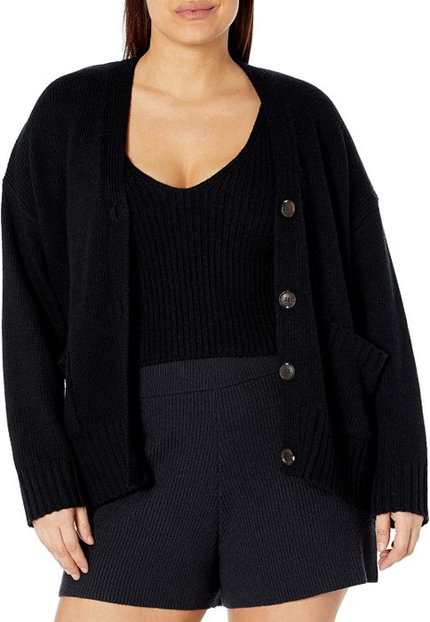 Model showcasing the black cardigan paired with the matching tank
