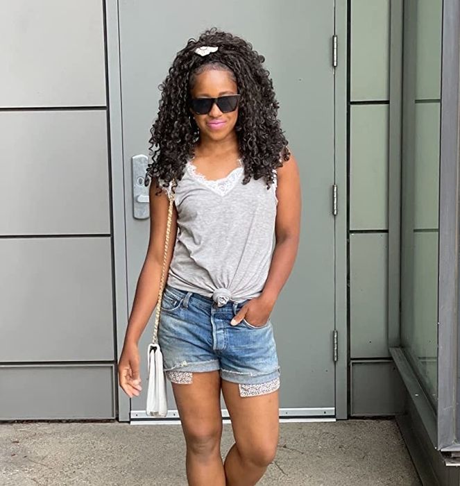 Reviewer showcasing the gray shirt