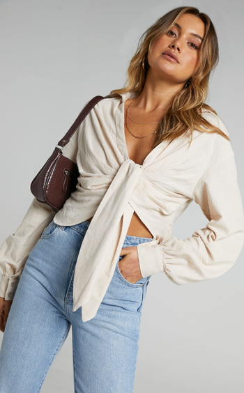 a model wearing the cream-colored version