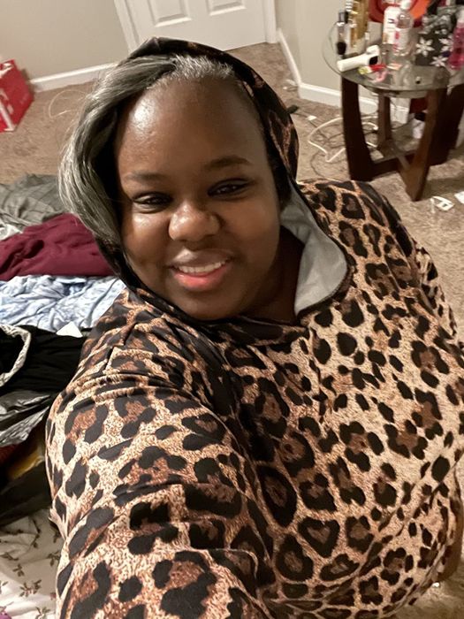 A reviewer wearing the leopard-print version