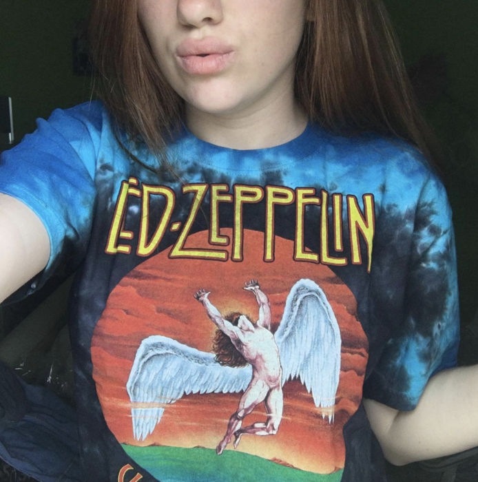 The reviewer is sporting a shirt featuring the iconic Led Zeppelin album logo.