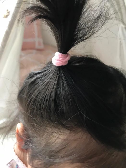 Photo of hair styled using the hair ties, shared by a reviewer