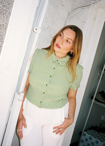 a model wearing the green version