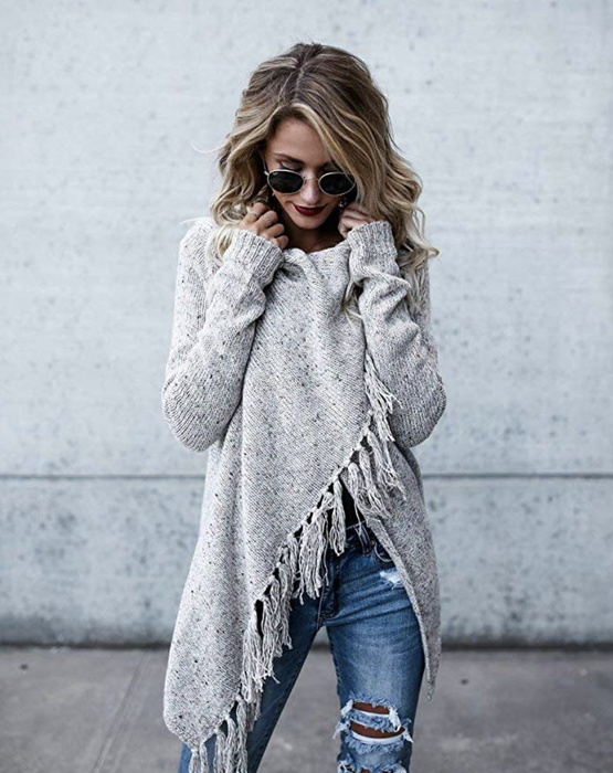 The model is styled in a gray sweater.