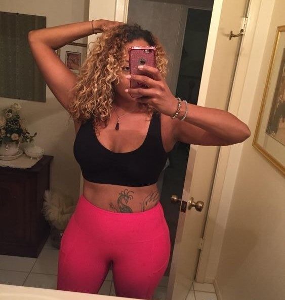 The reviewer is wearing the black sports bra.