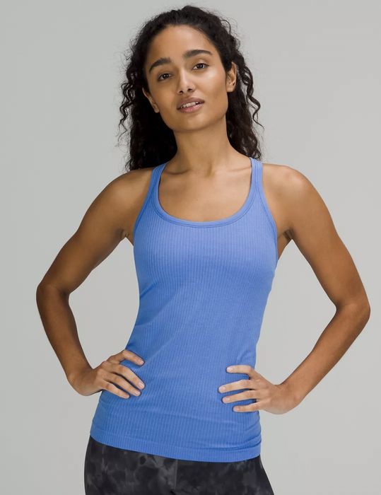 Front view of the model wearing the blue ribbed tank top.