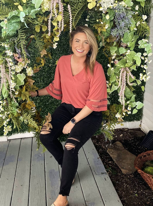 a reviewer showcasing the top in mauve