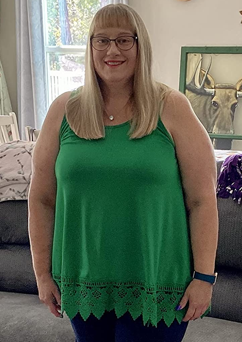 Image of a reviewer wearing a green tank top