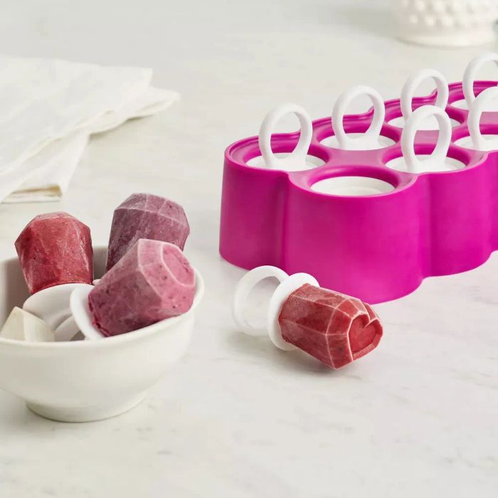 Silicone ice pop mold featuring gem-shaped ice pops, displayed in a bowl and on a table