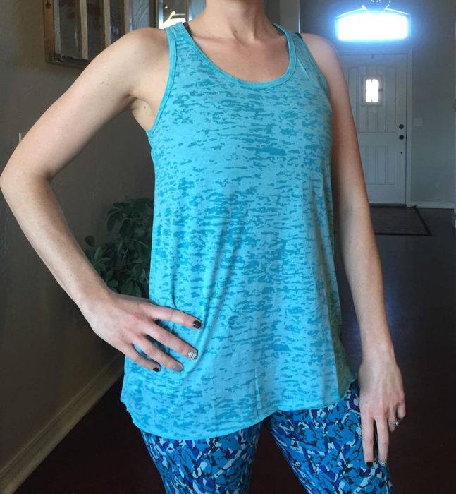 Image of a reviewer wearing a blue tank