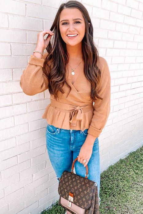 Another reviewer is seen wearing the sweater in a tan color.