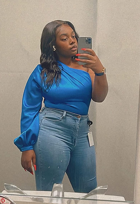 a reviewer styled in the blue top paired with blue jeans