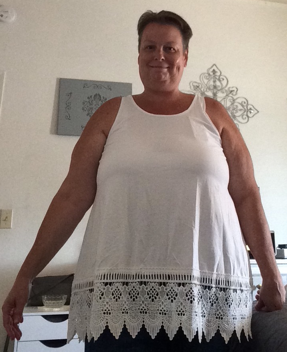 Image of a reviewer wearing a white tank top