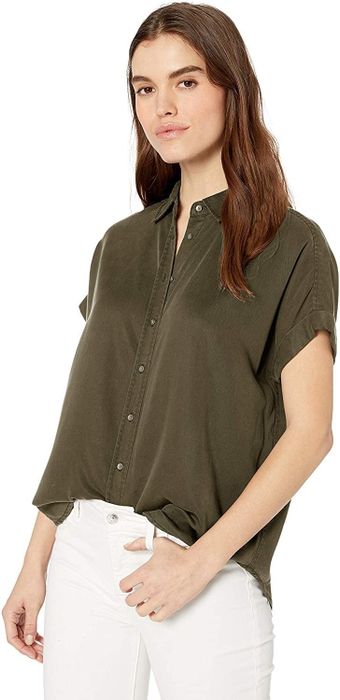 Model wearing a dark olive short-sleeve shirt from Daily Rituals