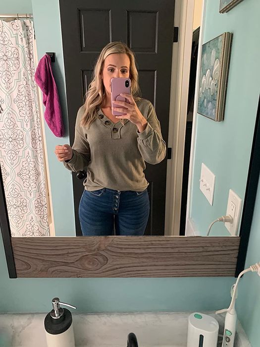 Reviewer wearing a brown long-sleeve waffle tee paired with jeans