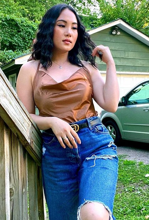 Reviewer showcasing the khaki-colored top