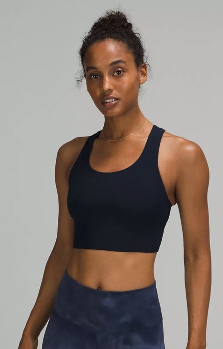 front view of model wearing the black sports bra