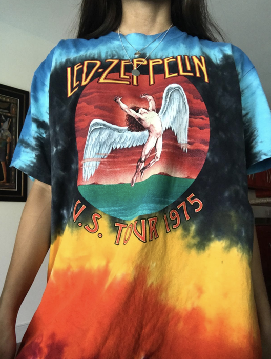 The reviewer is seen wearing a tie-dye shirt.