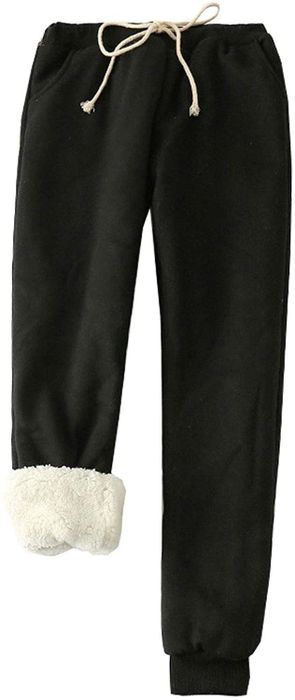 These black sweatpants feature a white drawstring and cozy sherpa lining for added warmth and comfort.