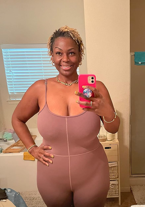 another reviewer in a nutmeg-colored one-piece workout bodysuit