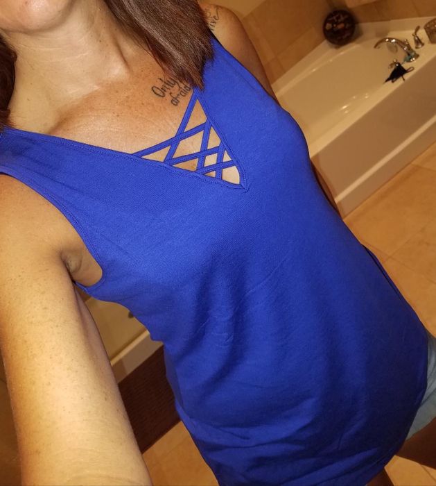 Image of a reviewer wearing a blue top