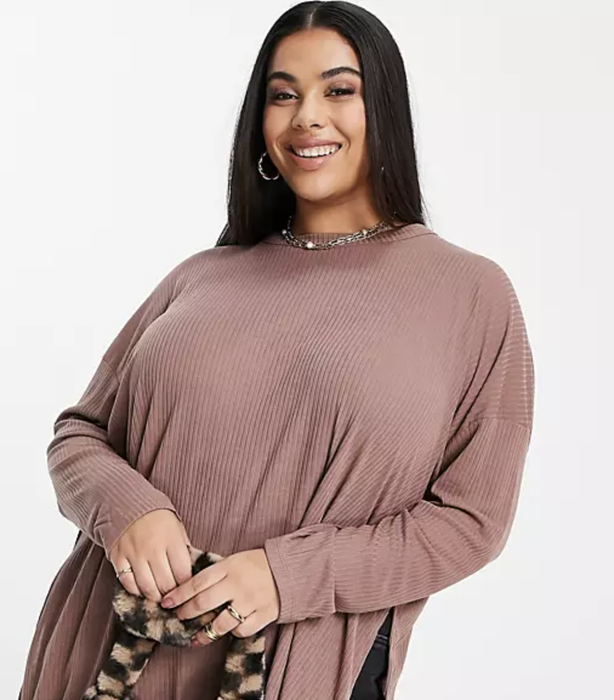 Stylist demonstrates the top's casual elegance in a daytime-ready ensemble