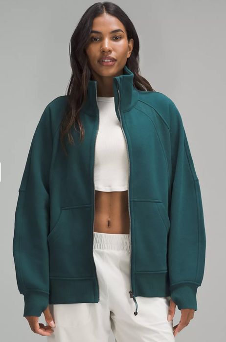A teal funnel-neck jacket