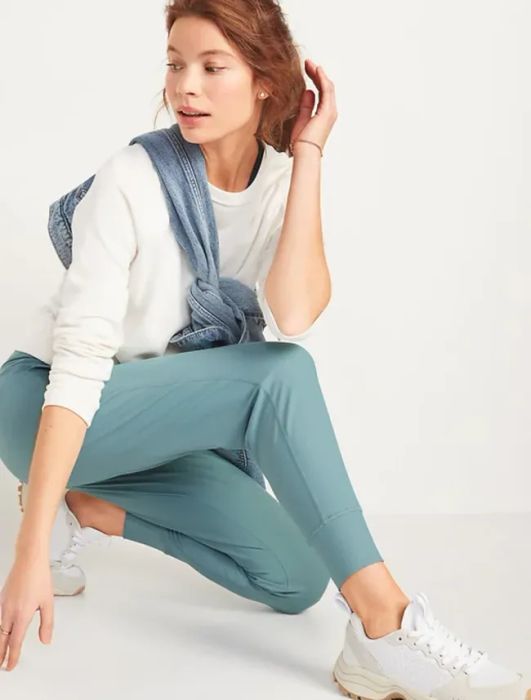 A model wearing a pair of light blue joggers