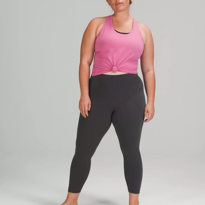 A model showcasing graphite grey high-rise ankle leggings