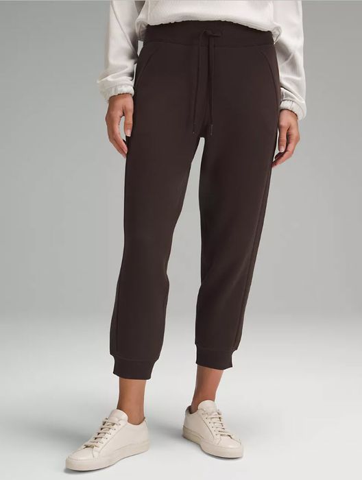 brown joggers with elastic waistband and sneakers