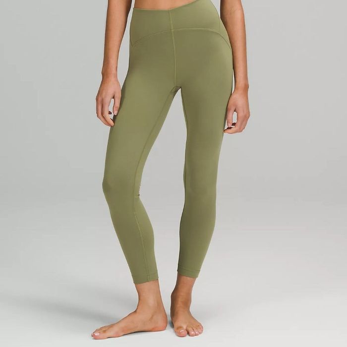 A model wearing the same high-rise ankle leggings in olive green