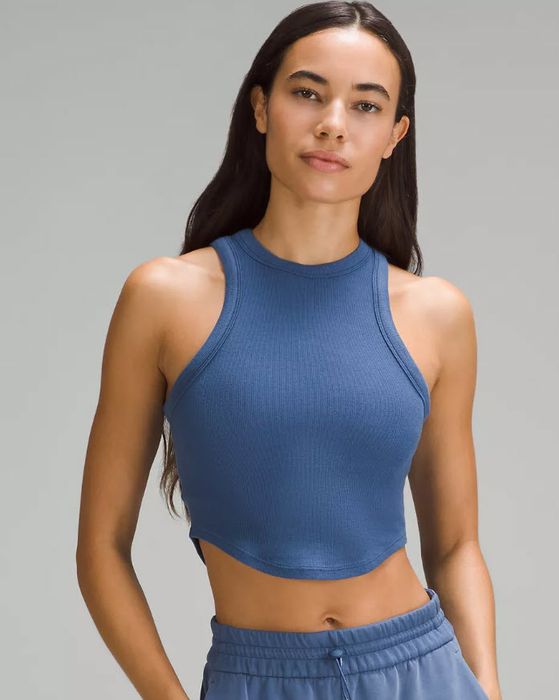 model in a blue cropped tank top