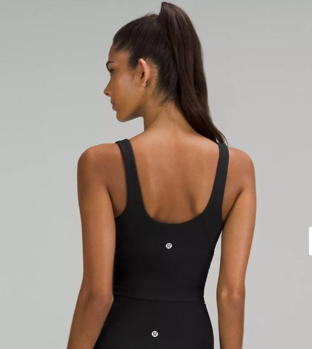 A view of the back of a black ribbed tank top