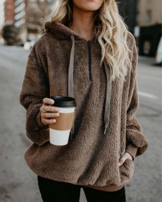 Styled with effortless chic in rich brown tones